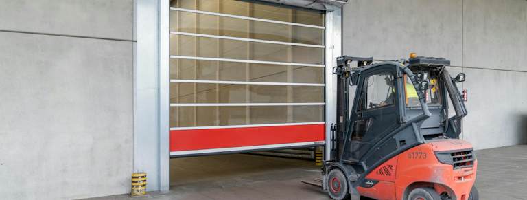 SG 5040 TurboLux high-speed door with a forklift passing through the opening
